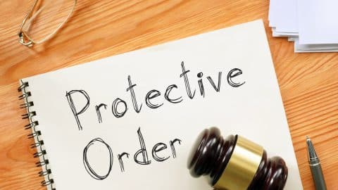 Protective Order Is Shown On A Photo Using The Text